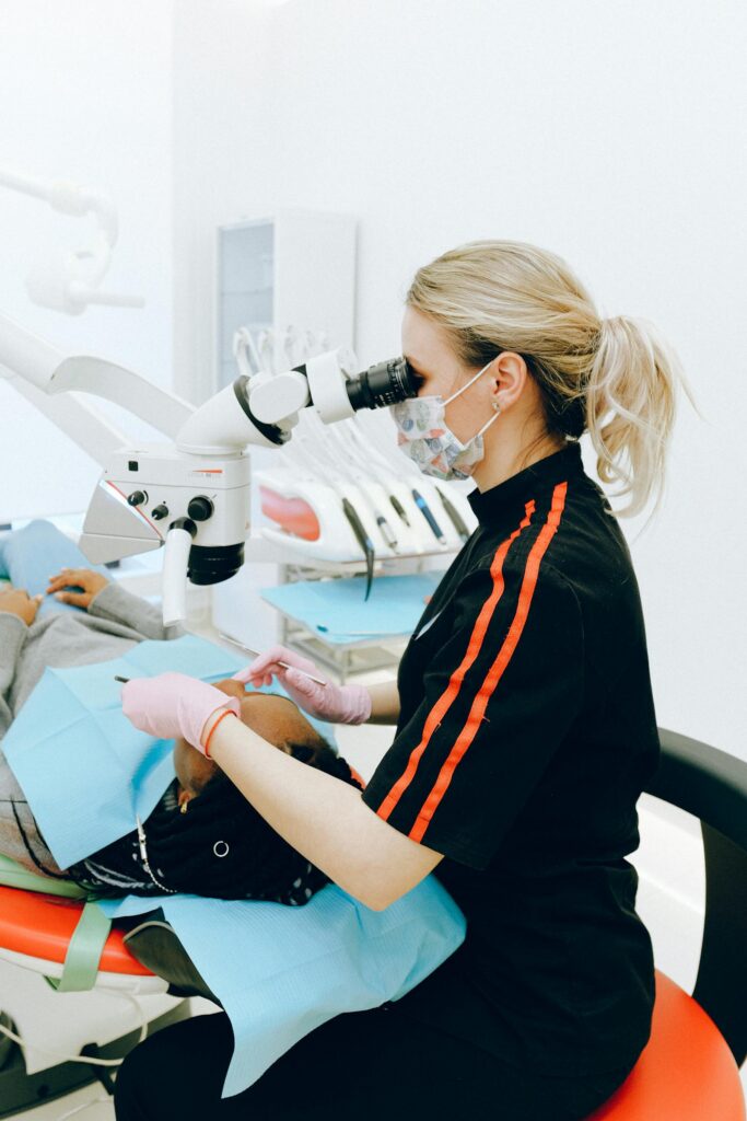 Smiling child with braces during pediatric orthodontic checkup at AQUA Dent Clinics, Jeddah